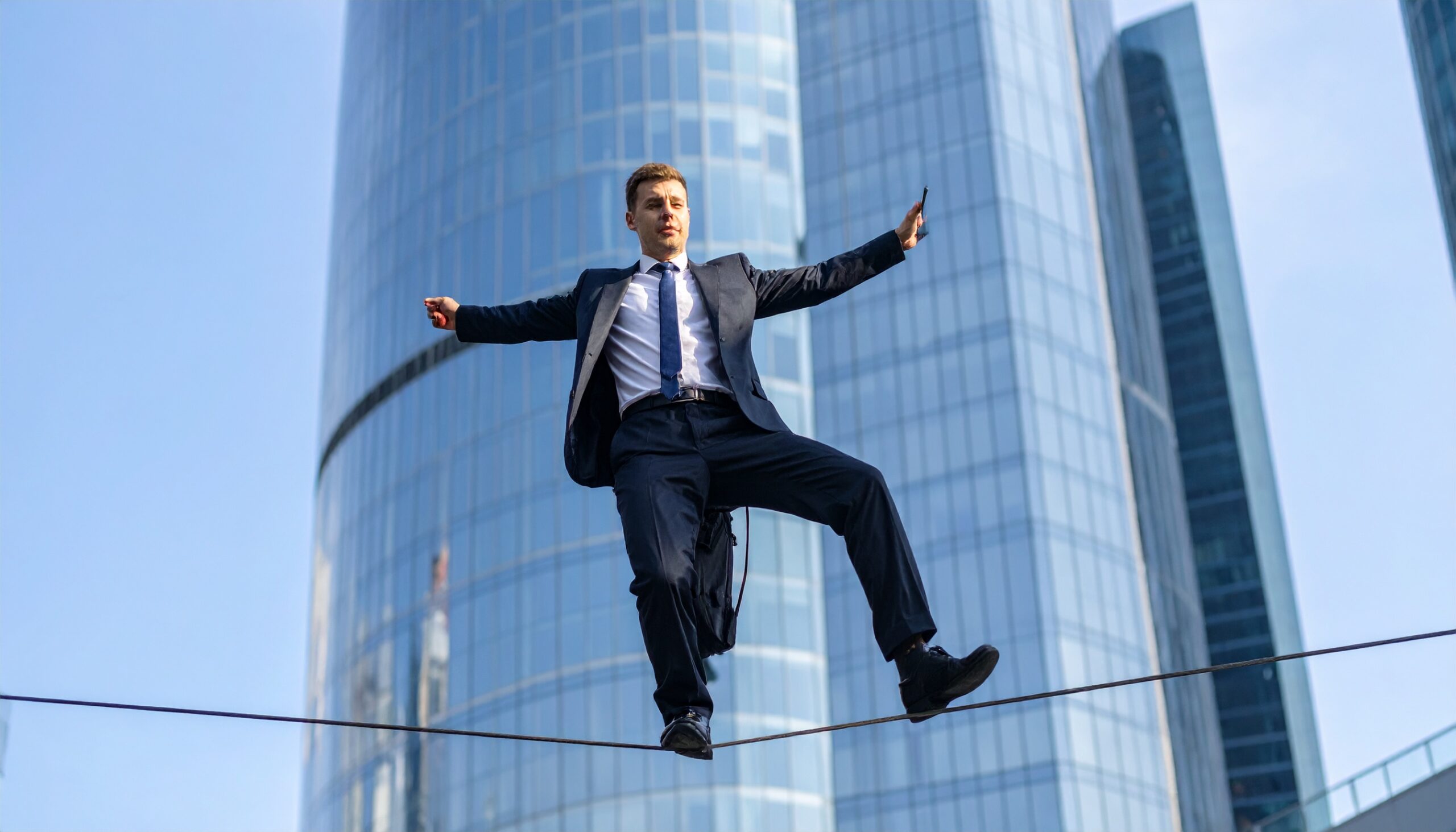 Firefly_ man in a suit in a business district balancing on a highwire with a phone in one han 74942